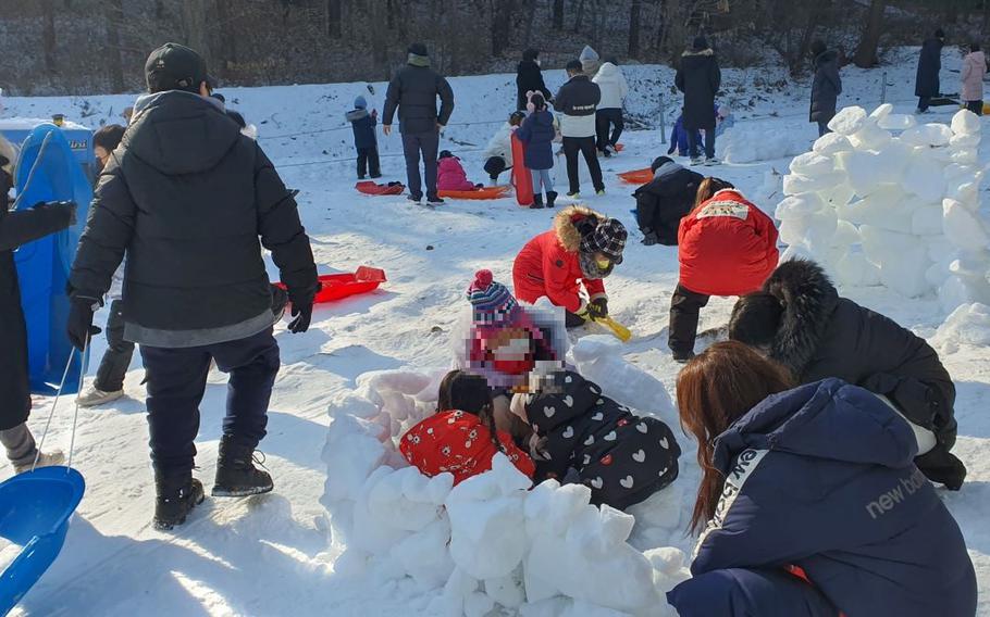 Children playing with snow at Mt. Moobong Youth Camp