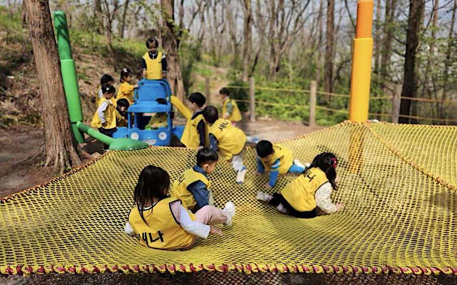 Children playing at Urban Forest Playground