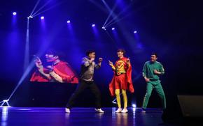 a scene from Busan International Comedy Festival; three people performing on stage
