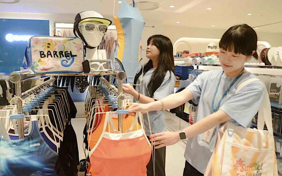 women checking swimming suits