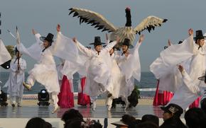 people in white traditional Korean cloth dancing