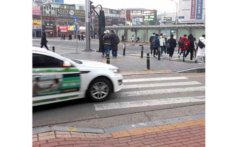 Photo Of Look both ways! Take caution when crossing street in Korea