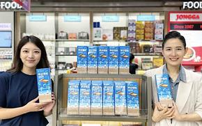 Lotte Duty Free staff holding products