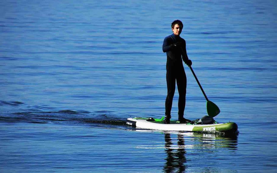 A man standing on sup.