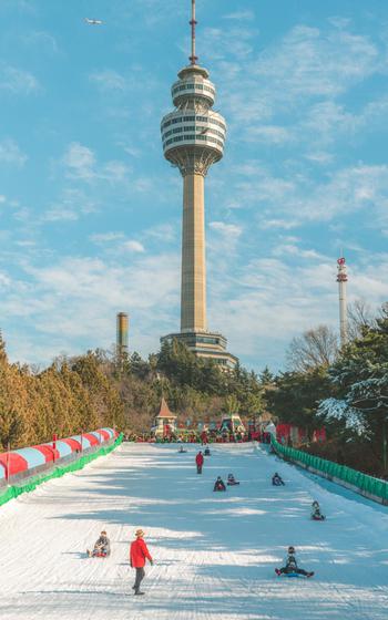 sledding slope and tower in the back ground at Eworld